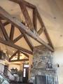 Hand-Hewn Timbers and Trusses / These hand-hewn timbers were stained by the contractor before installation Hand-Hewn Timbers and Trusses / These hand-hewn timbers were stained by the contractor before installation
